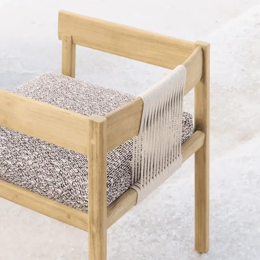 Elegant Unopiù Cora chair built using solid teak wood and pale cream synthetic cords