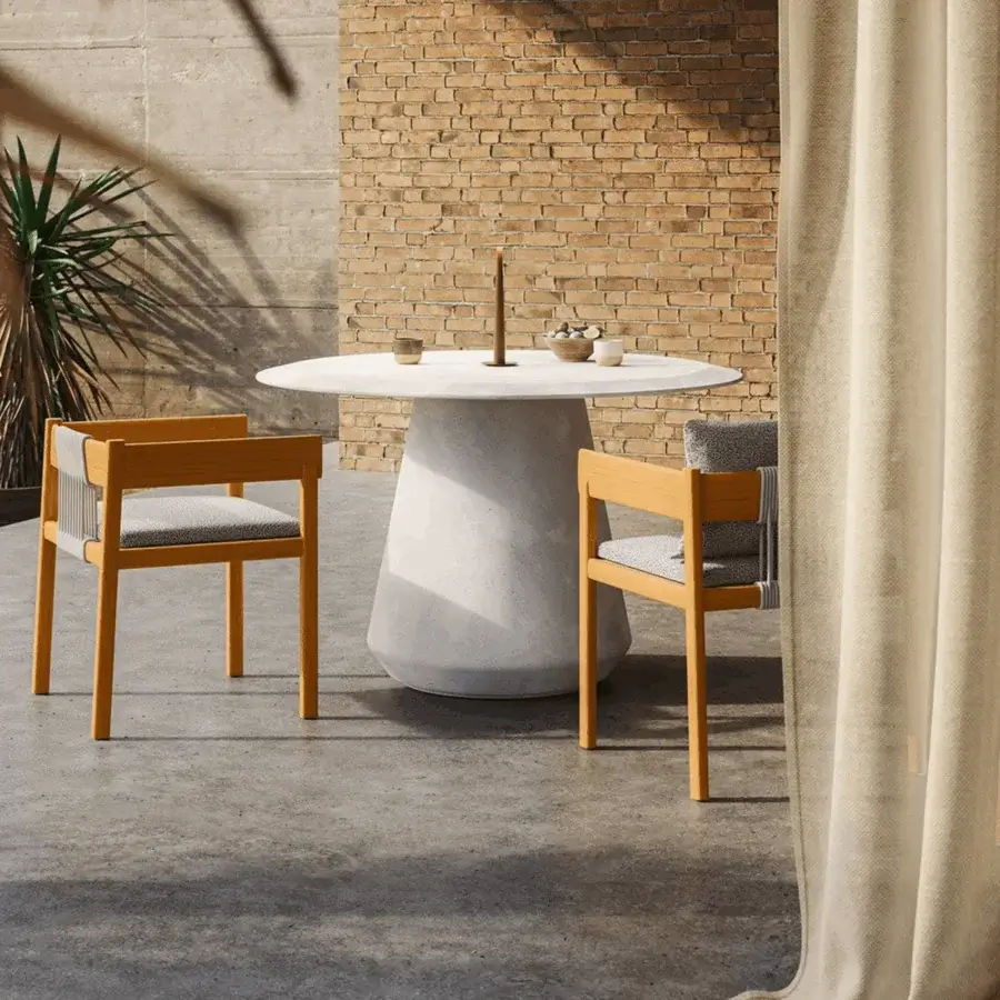 Luxury Unopiù Cora chair in solid teak with matte finish and intricately woven rope accents plus speckled textile cushions