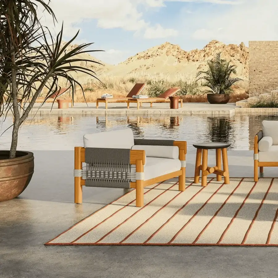 Luxury Unopiù Cora lounge chair with solid teak matte frame plus intricate dark and light woven rope panels soft cushions