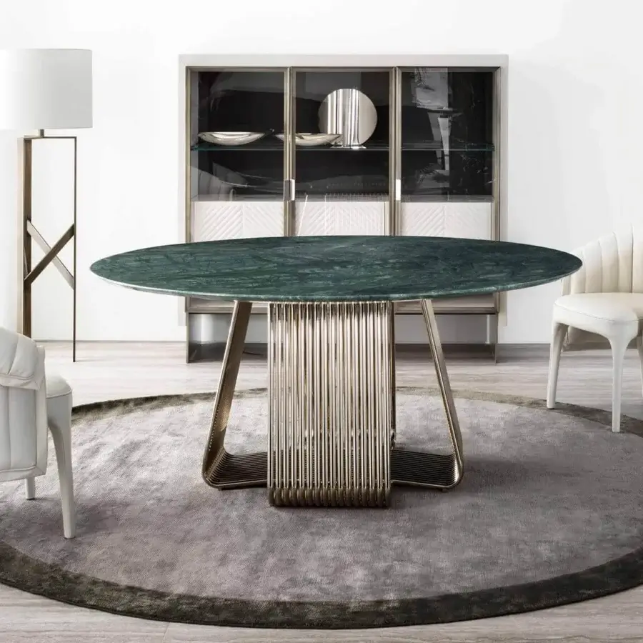 Exclusive Rugiano Alyson round table with refined marble top and skilfully curved light gold metal tubes