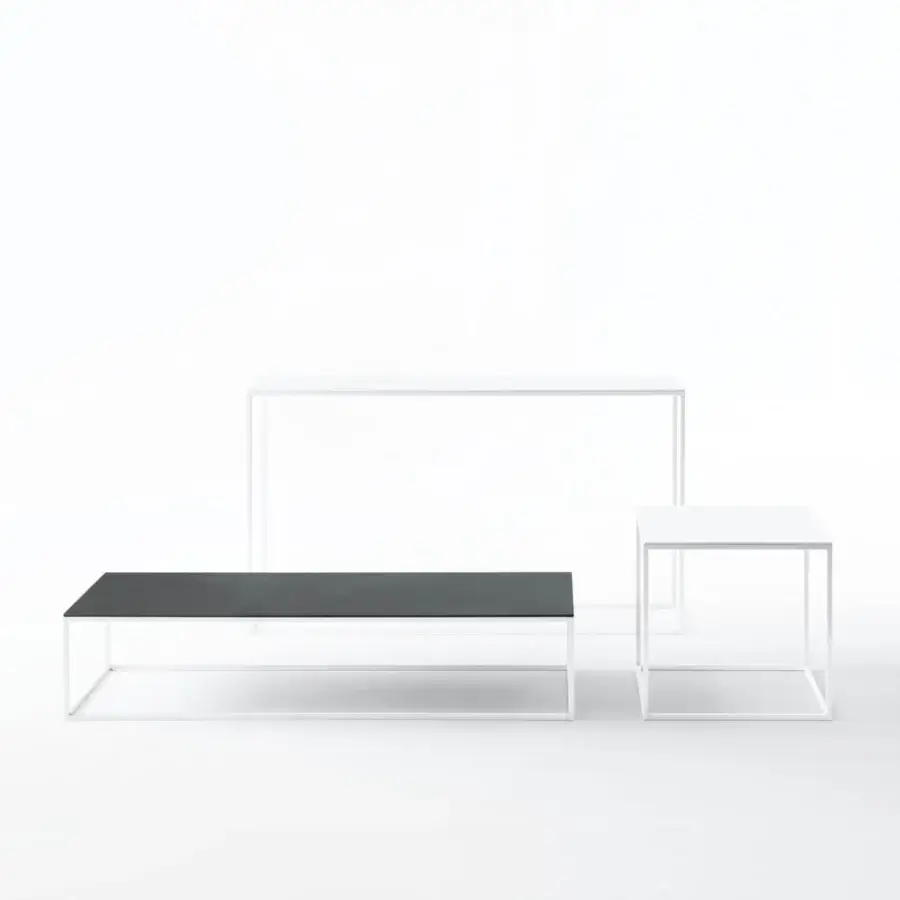 Elegant Desalto Helsinki 15 coffee table with smooth matte top supported by slim white finished steel frame and joints