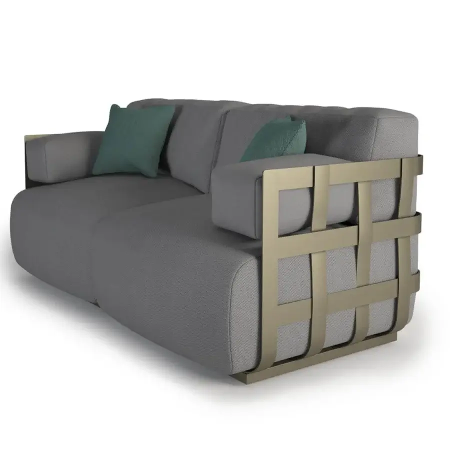 Captivating Rugiano Dafne sofa with bronze-painted aluminum basket structure and plush medium gray fabric upholstery including teal pillows