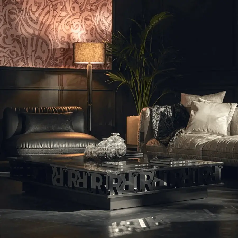 Luxury John Richmond coffee table with dark stone tabletop and metallic R letters on matte black plinth base construction