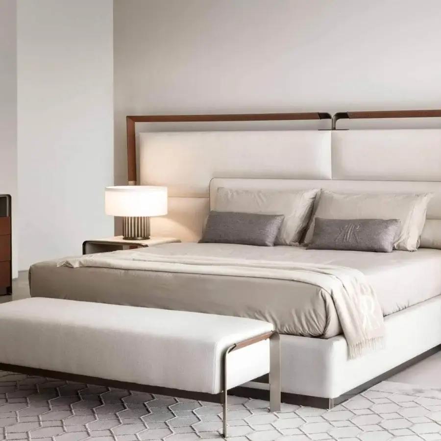 Elegant Rugiano Grace dresser with reddish-brown leather drawer fronts and a clear glass surface in a light gray matte frame