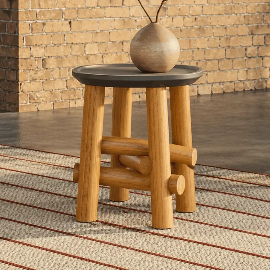 Sophisticated Unopiù Symi side table featuring dark charcoal tray top, warm teak base, and matte finish