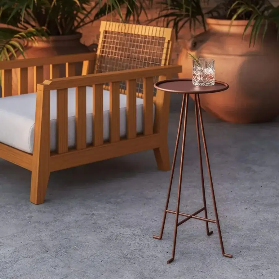 Luxury Unopiù Syros side table crafted from metal in terracotta finish showcasing minimalist silhouette