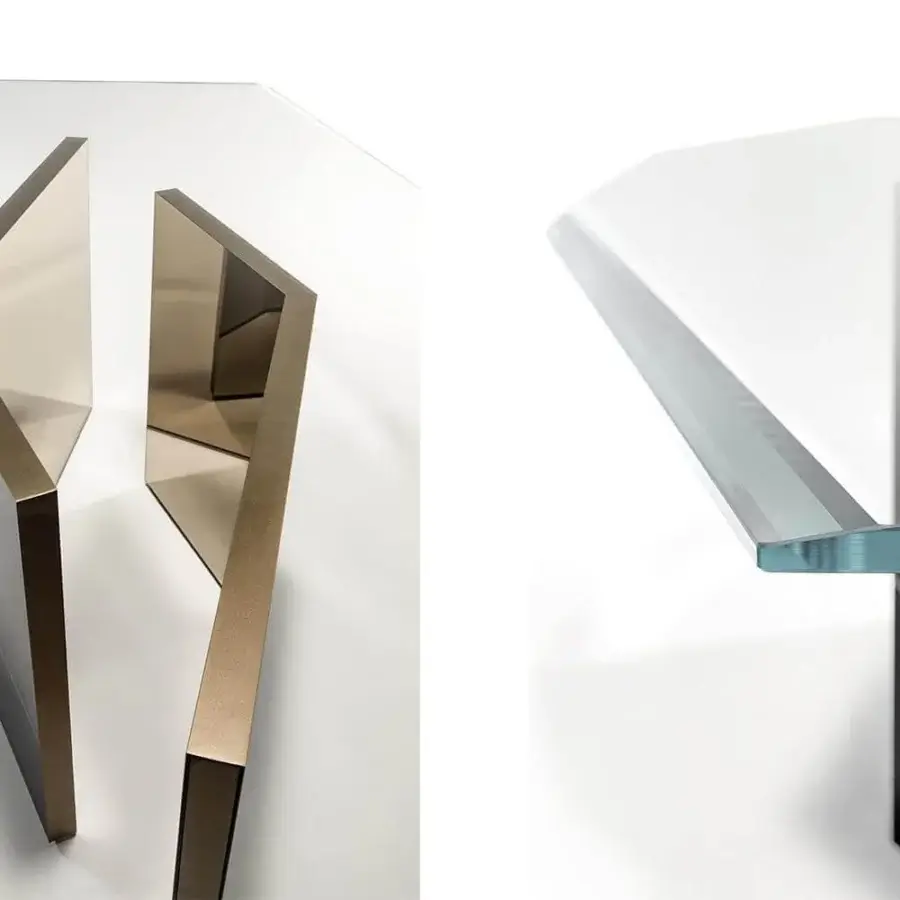 Distinguished Reflex Cubitum table with transparent extra clear glass and a unique geometric base in bronze finish