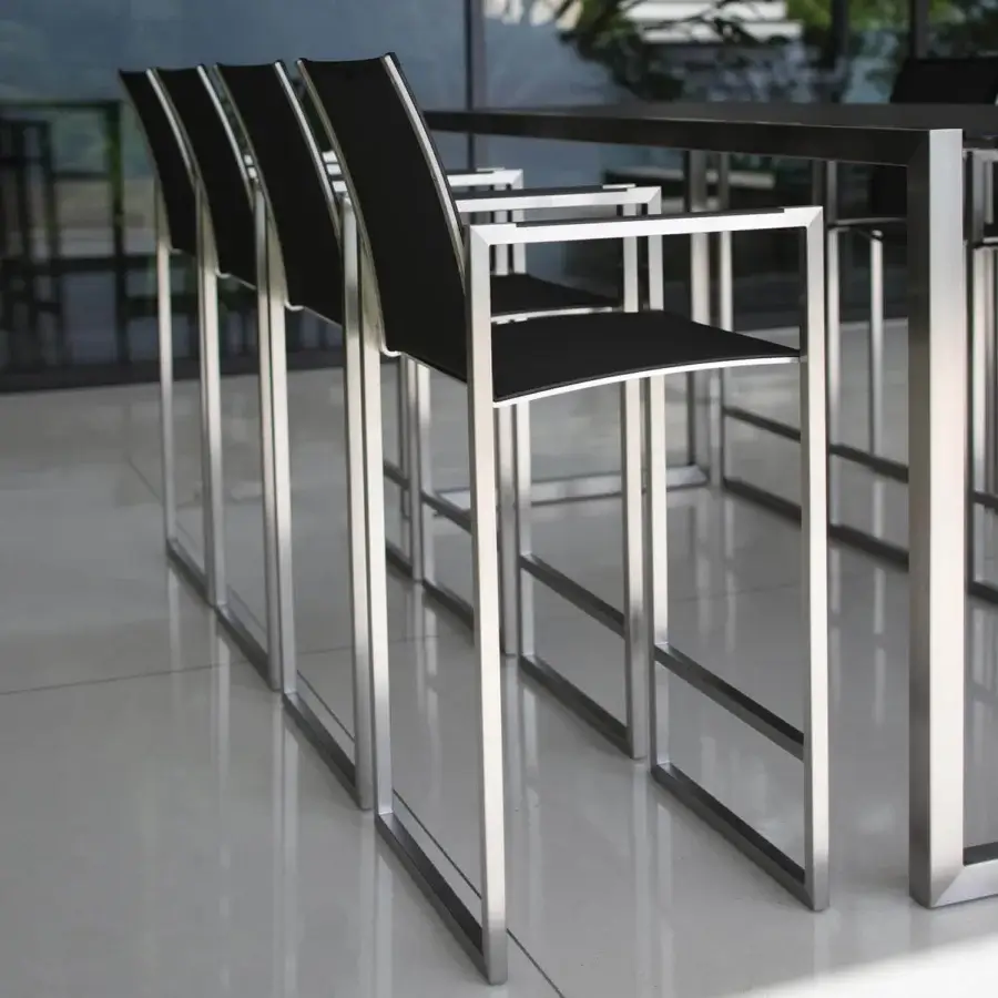 Superior Royal Botania Ninix stool with stainless steel frame and black Batyline seat and backrest exhibiting a silvery finish