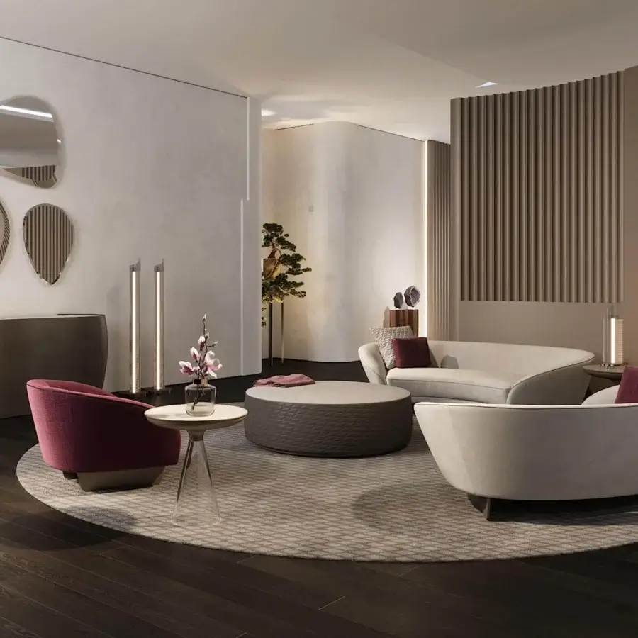 Superior Reflex Segno lounge chair upholstered in light gray textile with bronze finished continuous metal legs and burgundy accent pillow