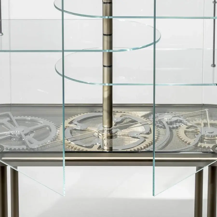 Exceptional Reflex Big Ben bar cabinet with extra clear glass structure and synchronized opening doors revealing gold and chrome gears