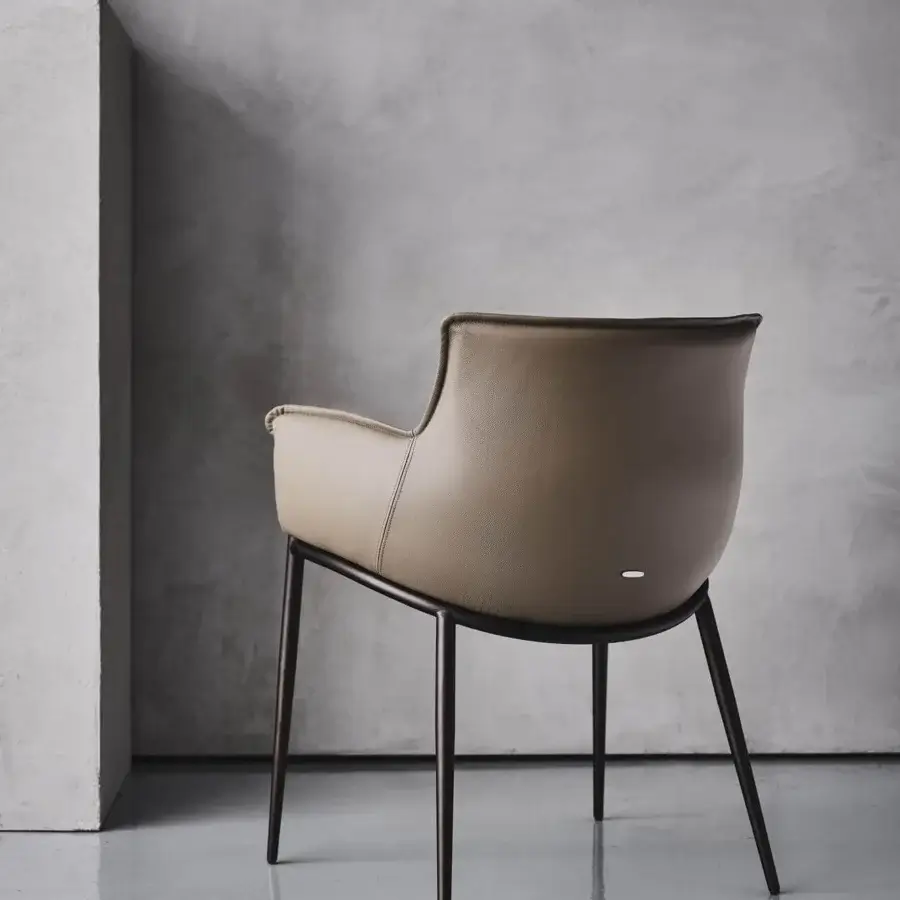 Refined Cattelan Italia Rhonda armchair in soft taupe leather with titanium embossed lacquered steel base