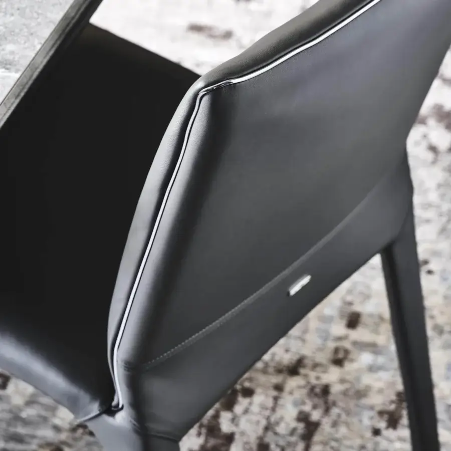 Elegant Cattelan Italia Penelope chair upholstered in dark leather with gun metal grey piping and a steel frame