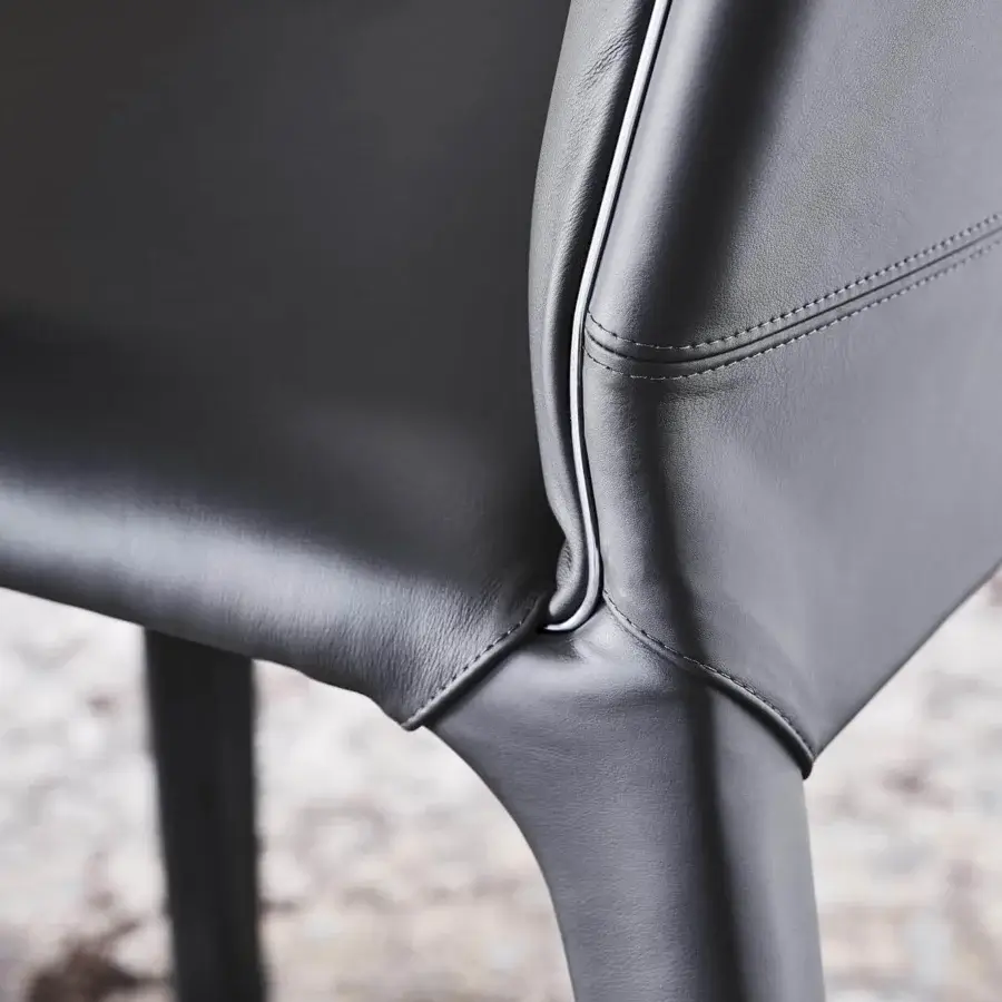 Distinguished Cattelan Italia Penelope chair crafted in soft gunmetal gray leather with a sculpted form and delicate accent line