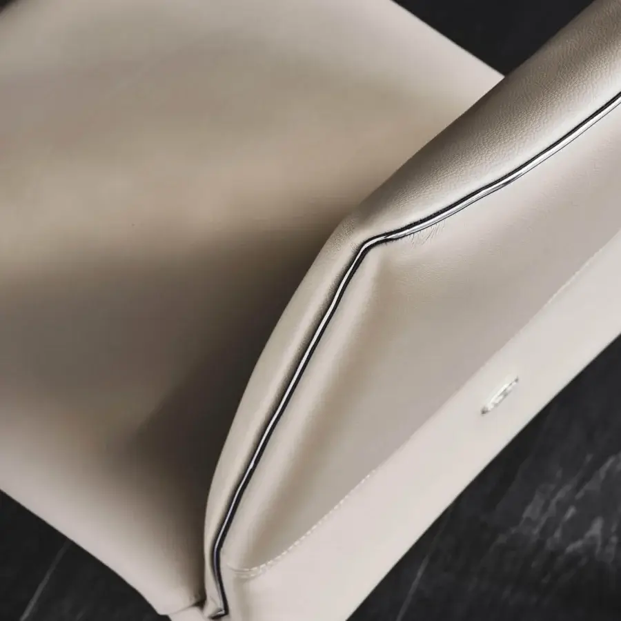 Distinguished Cattelan Italia Penelope chair with soft light beige leather and gun metal grey piping in a smooth matte finish