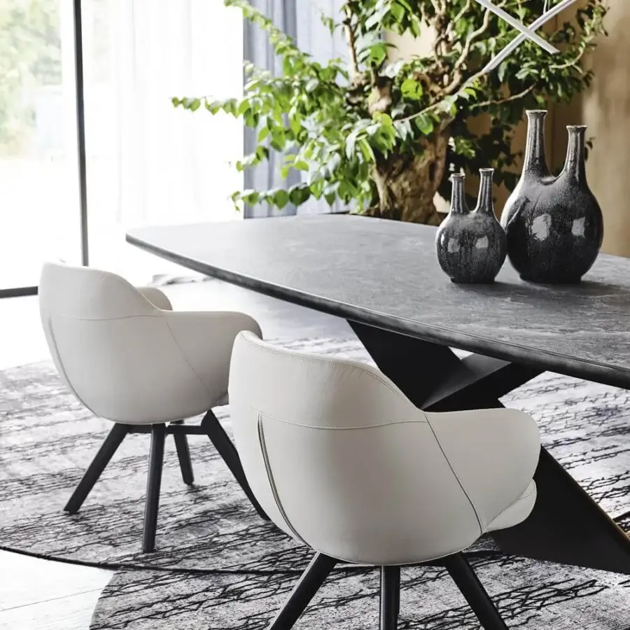 Distinguished Cattelan Italia Bombè armchair with light off-white synthetic leather and graphite embossed lacquered steel with Canaletto walnut legs