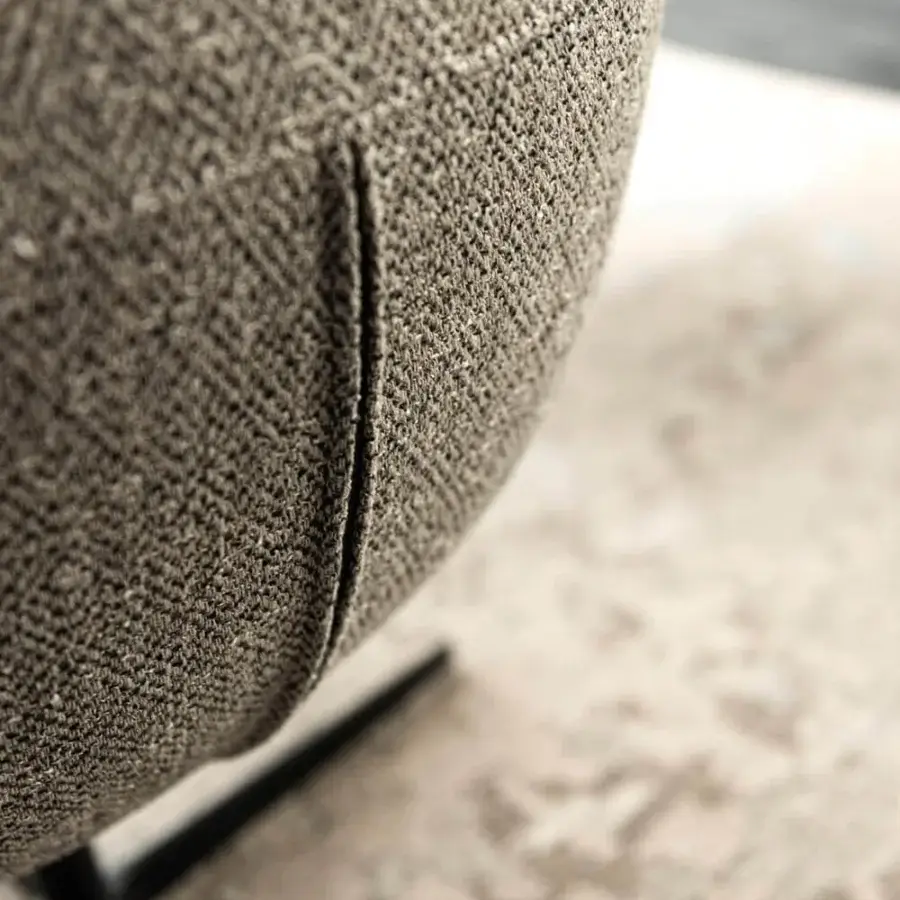 Distinctive Cattelan Italia Bombè X armchair upholstered in textured grey-brown fabric with a black embossed lacquered steel base