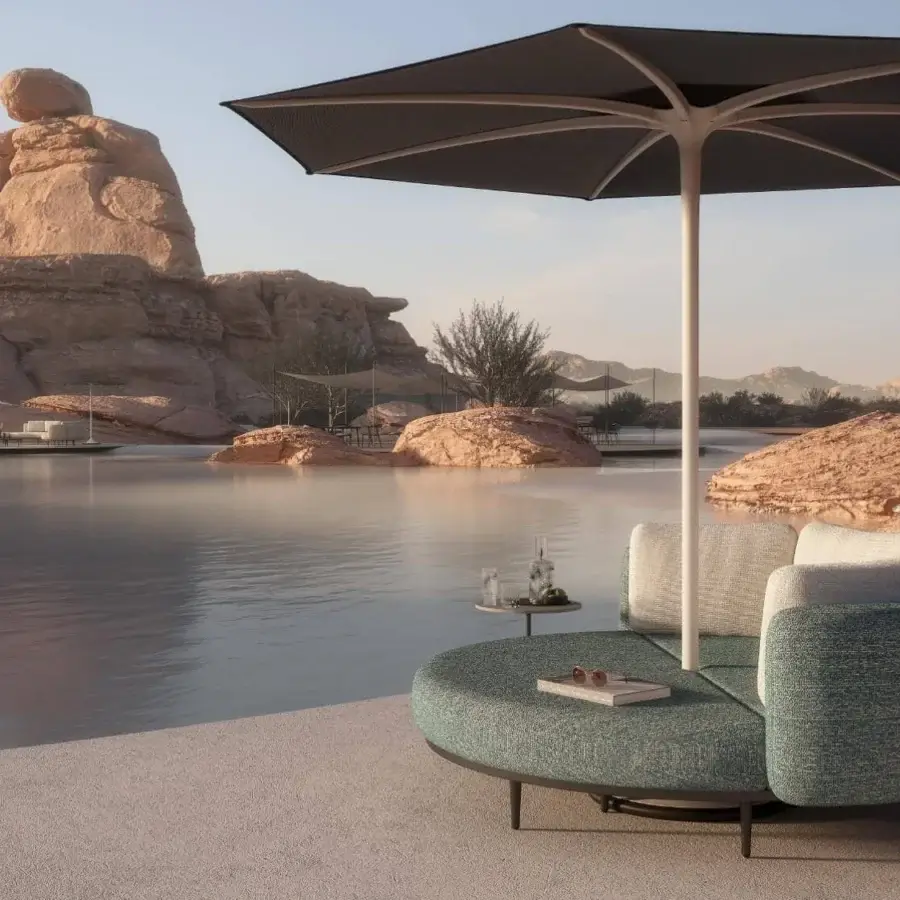 Stylish Royal Botania Organix Lounge lounger with a circular aluminum base and cool blue-green textured cushions for unique configurations
