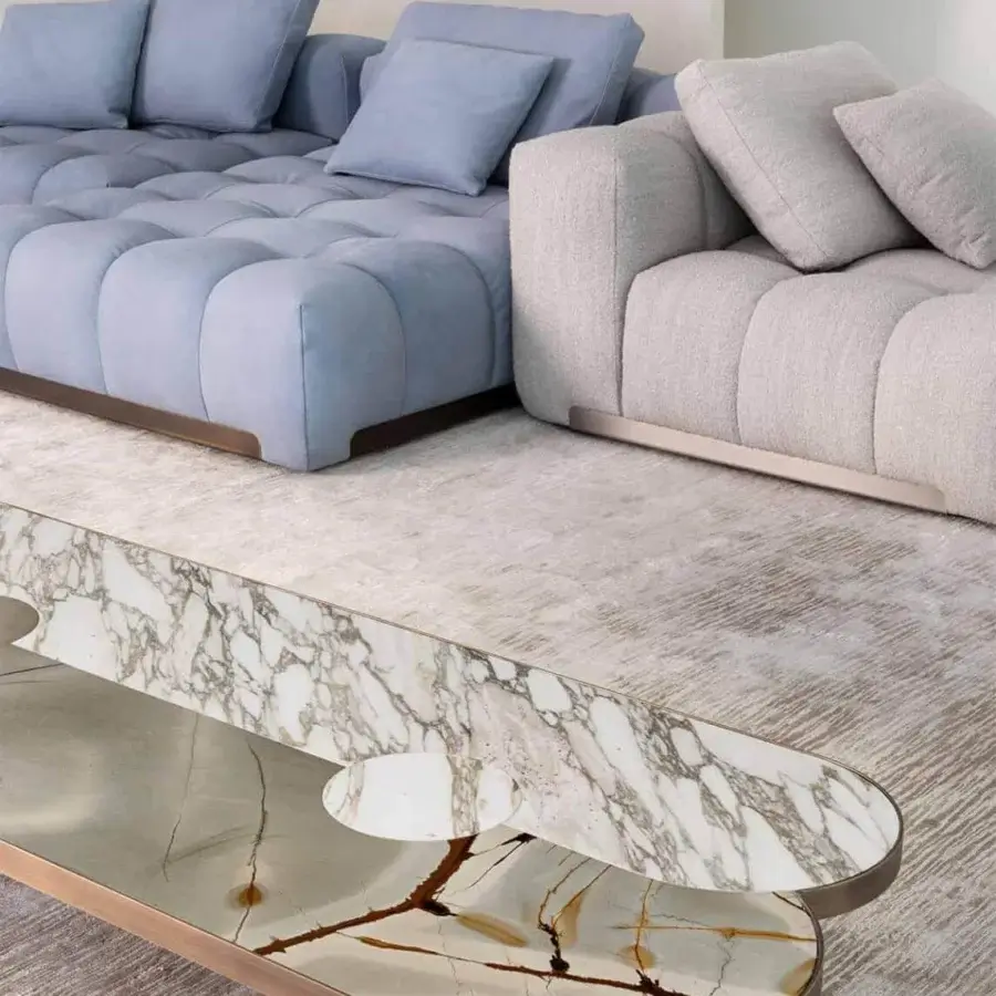 Elegant Rugiano Yacht sectional with light blue and light gray textiles built with tufted design and bronze brass metal details