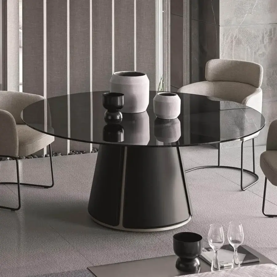 Distinguished Ditre Italia Claire table with circular glass top and dark matte recycled bonded leather base