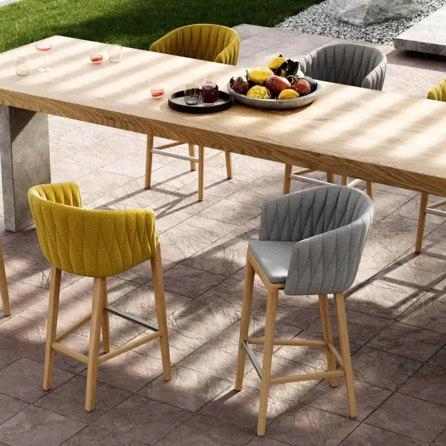 Exceptional Royal Botania Calypso stool with warm yellow textured textile and teak base crafted with a stainless steel backrest