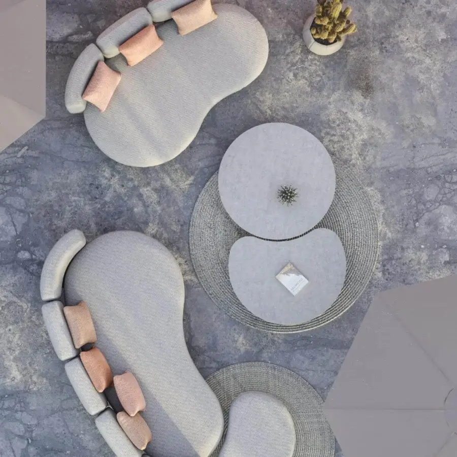 Superior Royal Botania Organix lounge sofa with organic silhouette, light grey textile and subtly textured matte finish with pink pillows