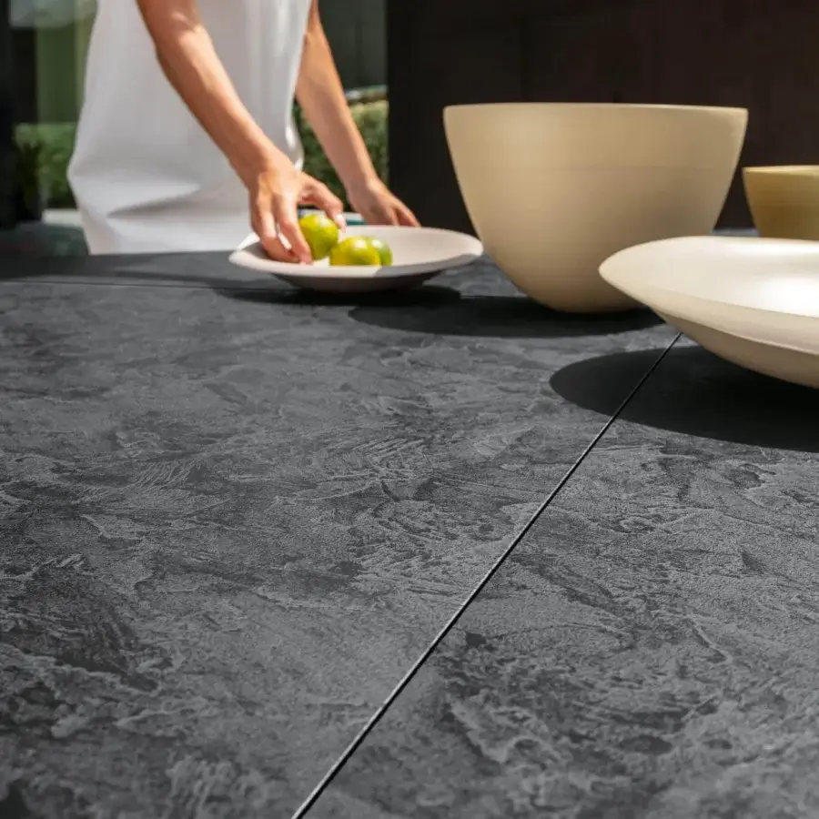 Exclusive Talenti Leaf table with dark gray textured Vitter top and matte finish for elegant outdoor dining