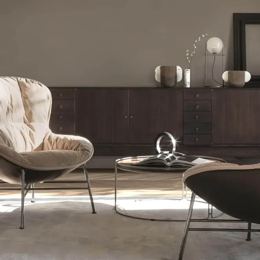 Innovative Ditre Italia Softy lounge chair with light beige textile and darker brown leather shell supported by satin-finish metal base