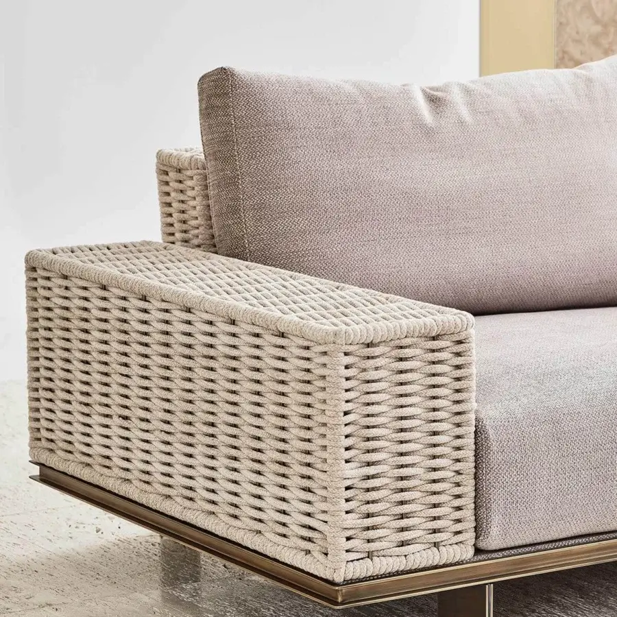 Elegant Rugiano Memphis sofa with a metal base and braided beige velvet rope complemented by soft fabric cushions