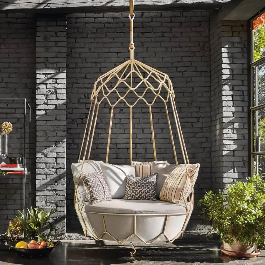 Exceptional Roberti Rattan Gravity lounge chair with a stainless steel frame, golden finish, and light grey cream cushions