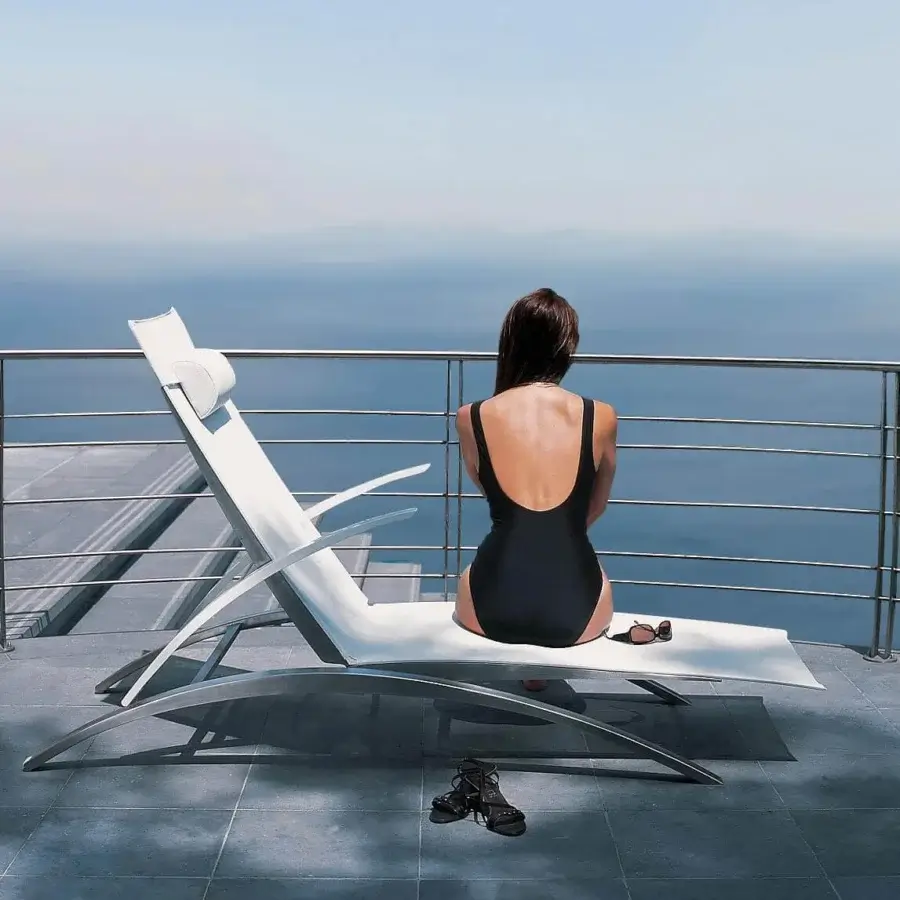 Distinguished Royal Botania O-Zon lounger with brushed stainless steel frame and smooth white Batyline material, complemented by a head-cushion