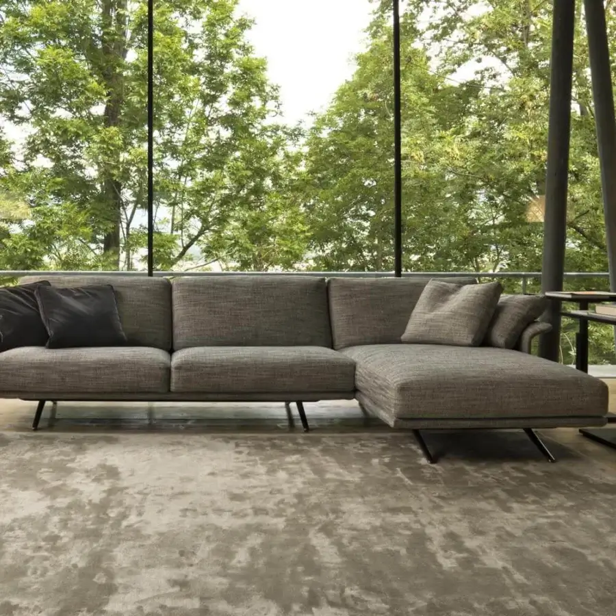 Innovative Verzelloni Nilson sectional with light gray textured textile upholstery and sleek dark metal legs