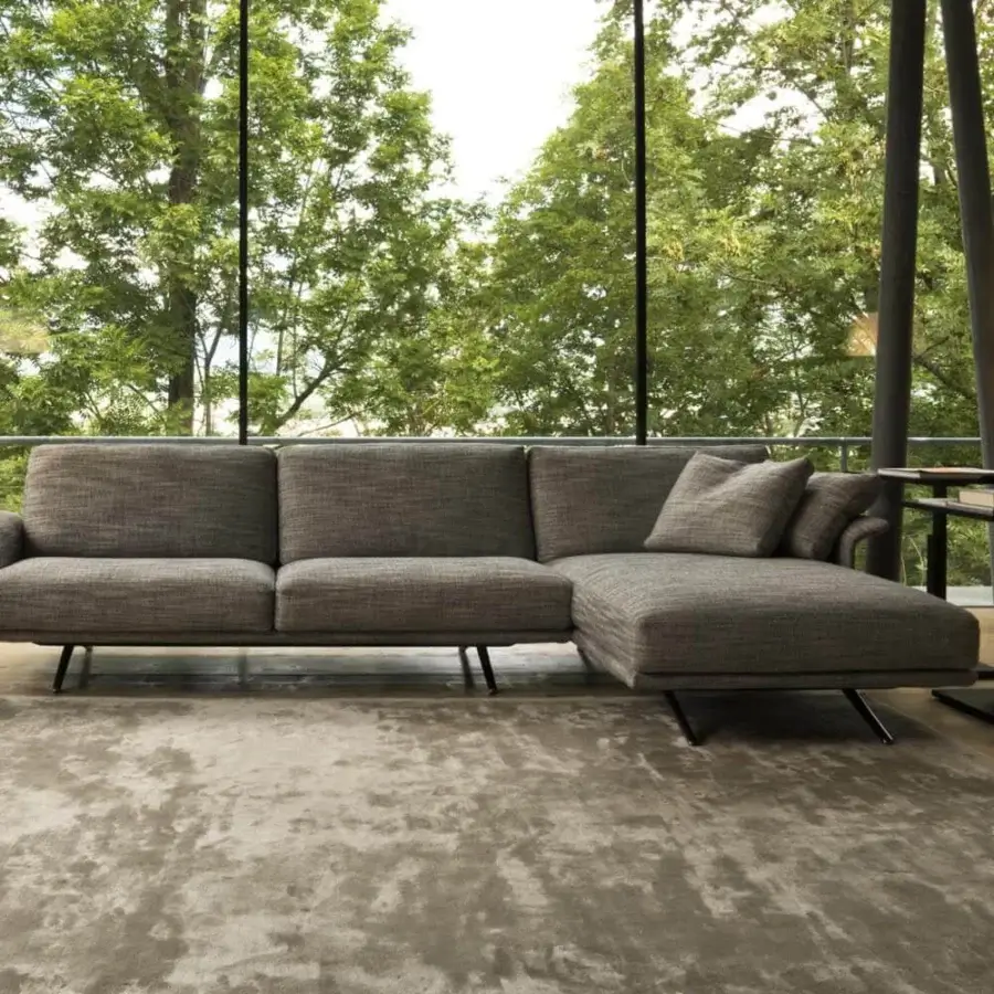 Superior Verzelloni Nilson sectional with smooth matte grey textile upholstery and refined curved armrests built with sleek metal legs