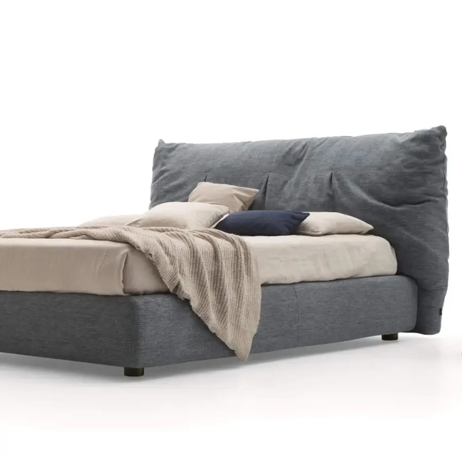 Elegant Ditre Italia Papilo bed with textile-covered frame and pillow-like headboard in textured matte grey with dark wooden legs