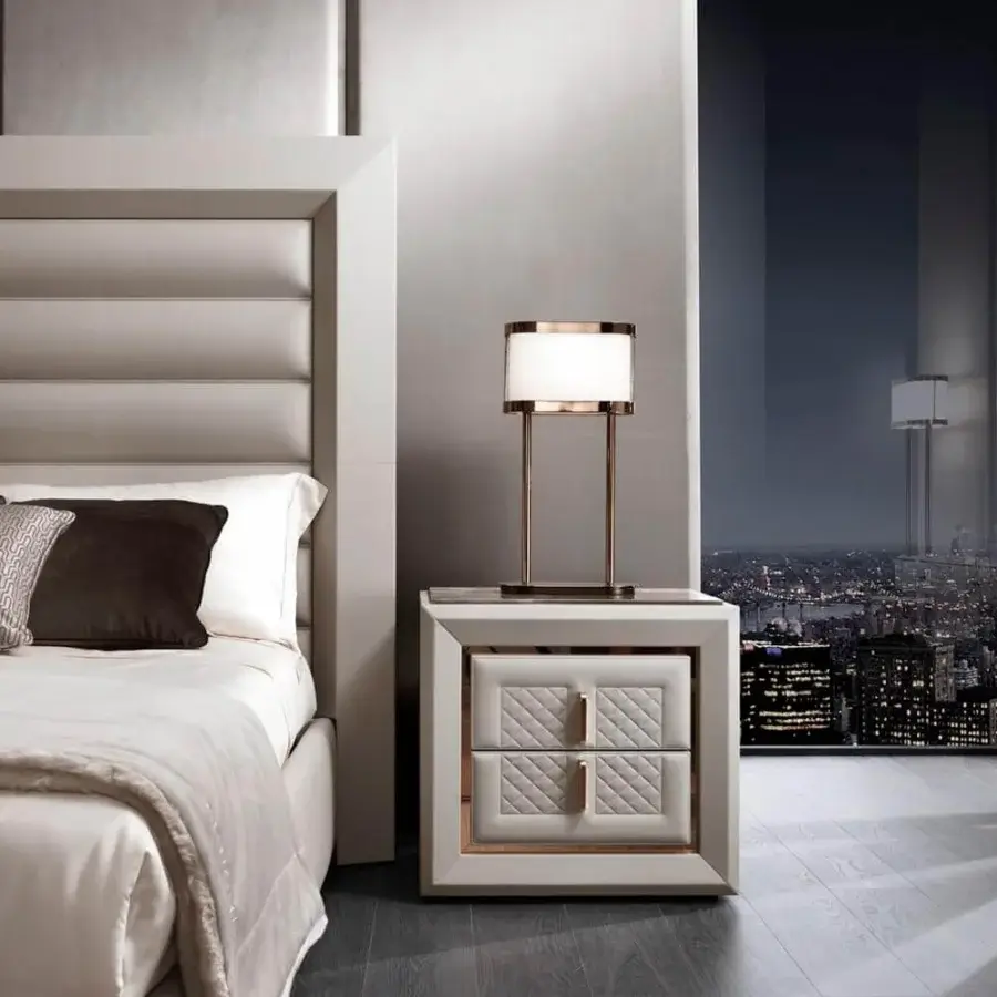 Distinguished DV Home Collection Adler nightstand with multilayer structure covered in light cream quilted leather and matt lacquer accents