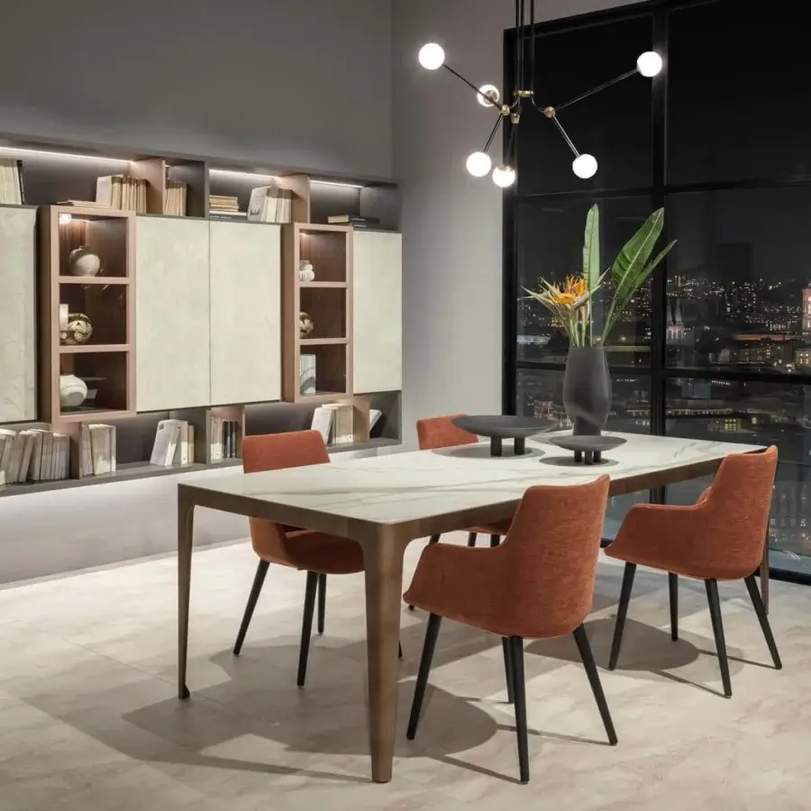 Superior Presotto Divina armchair with soft form upholstered in warm orange textile and black lacquer ash legs