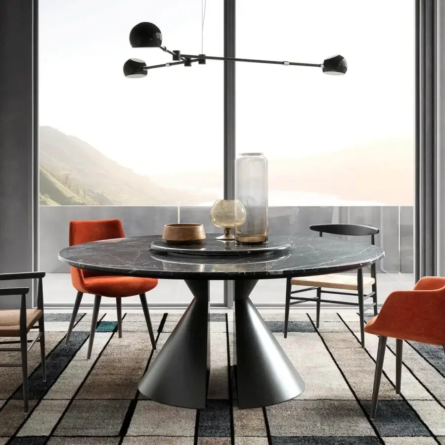 Captivating Presotto Divina armchair with enveloping form upholstered in vibrant orange textile and black lacquer ash legs