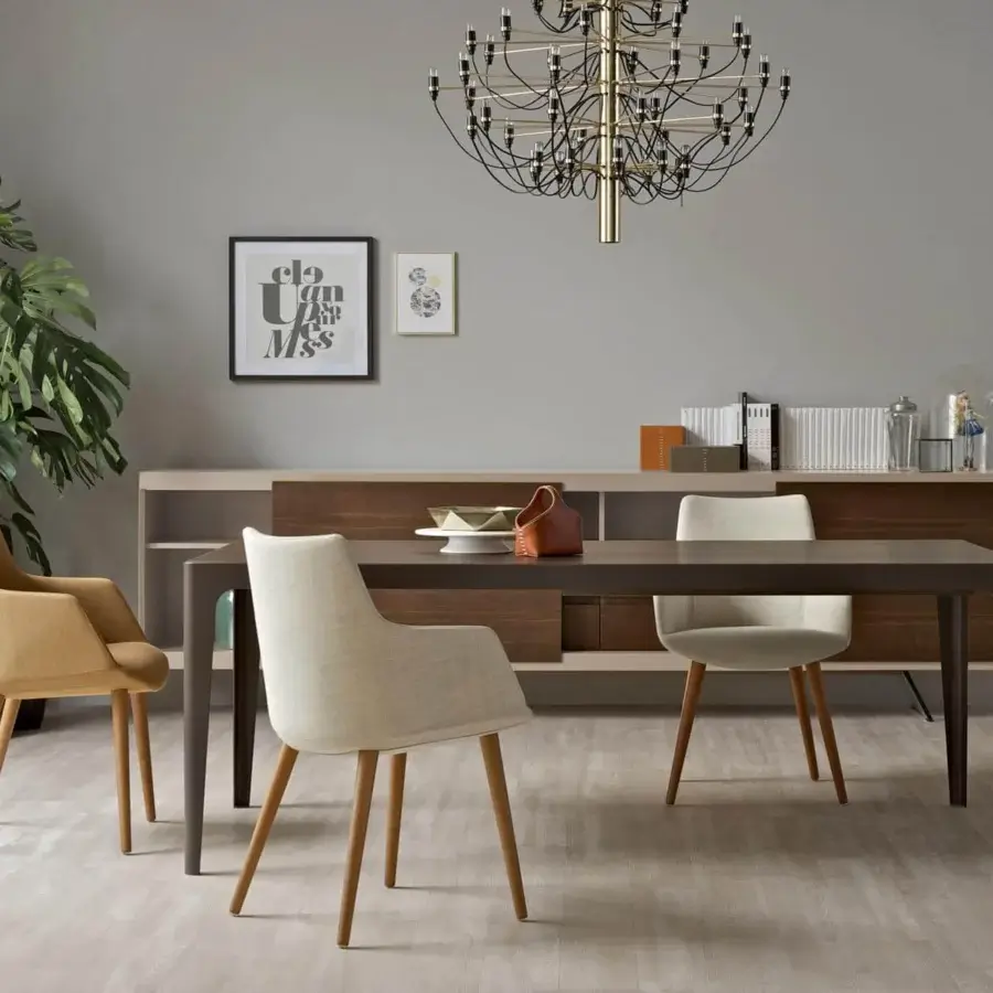 Elegant Presotto Divina armchair with soft silhouette upholstered in pale yellow textile and natural ash wood legs