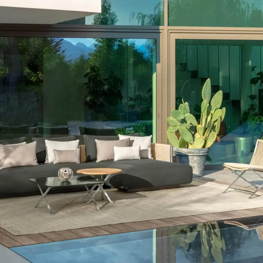 Exceptional Talenti George coffee table with a round accoya wood top and transparent glass second tier built with a stainless steel base