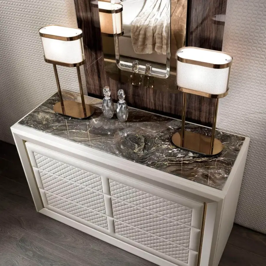 Lavish DV Home Collection Adler dresser in white leather with gold-toned metal and dark swirling marble, crafted in Italy with a matt lacquered interior
