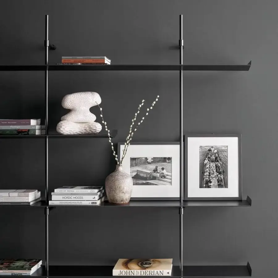 Elegant Bonaldo Foil bookcase with intersecting painted aluminum shelves and metal uprights creating a minimalist design