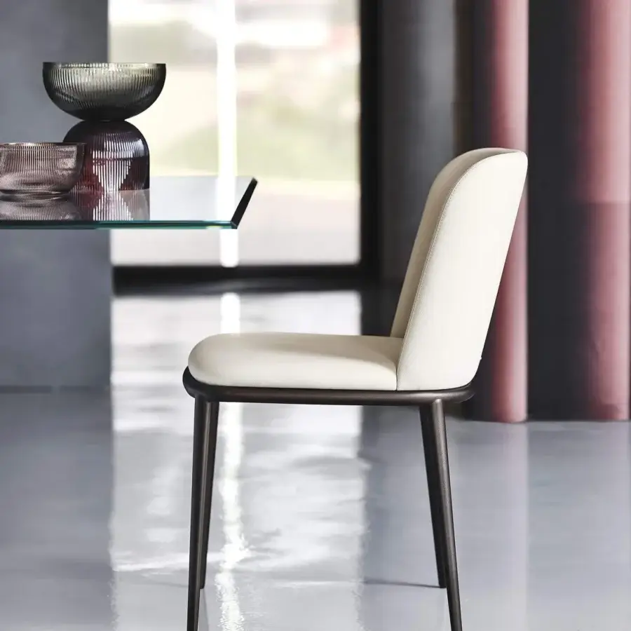 Distinguished Cattelan Italia Magda ML chair with enveloping light cream upholstery and dark matte metal frame