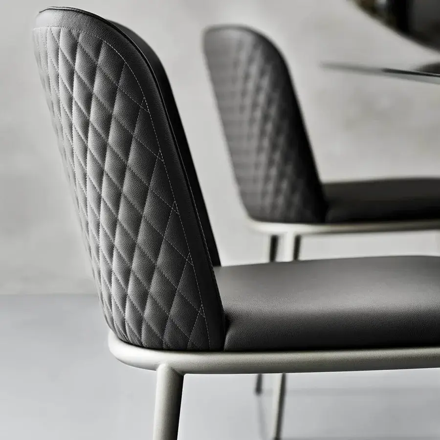 Exquisite Cattelan Italia Magda ML Couture chair with dark upholstery and glam diamond-quilting on the backrest, built with a matte silver-toned metal frame