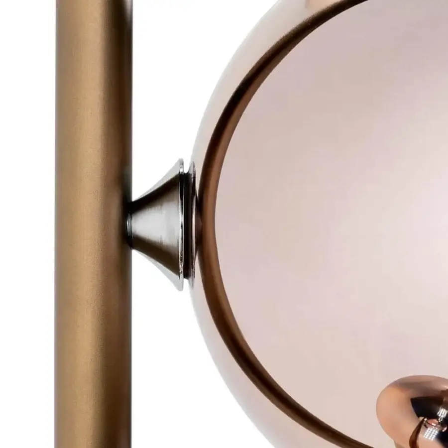 Distinguished Reflex Bulles XL floor lamp with a bronze metal structure and transparent borosilicate glass sphere in a rosy hue
