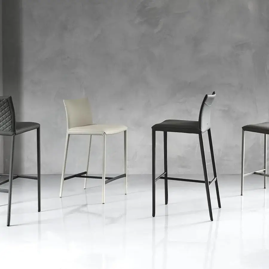 Sophisticated Cattelan Italia Norma stool with light gray textile and matte steel, exhibiting a curved backrest design