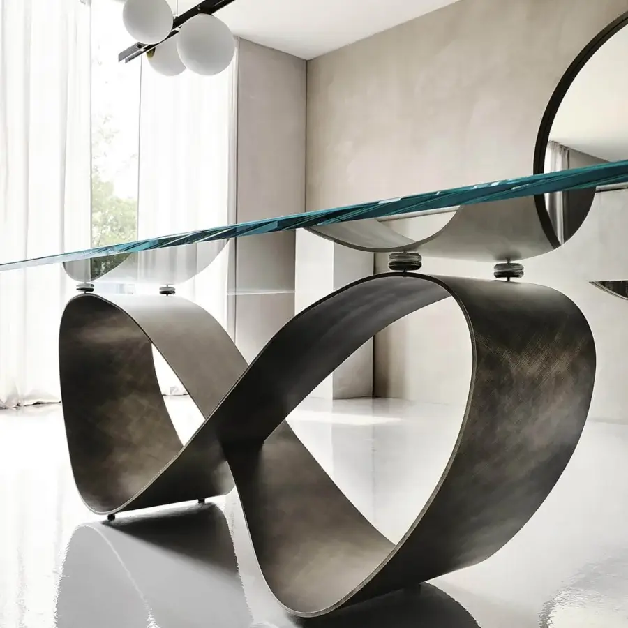 Exceptional Cattelan Italia Butterfly table with a clear glass top and sculptural bronze embossed lacquered steel base