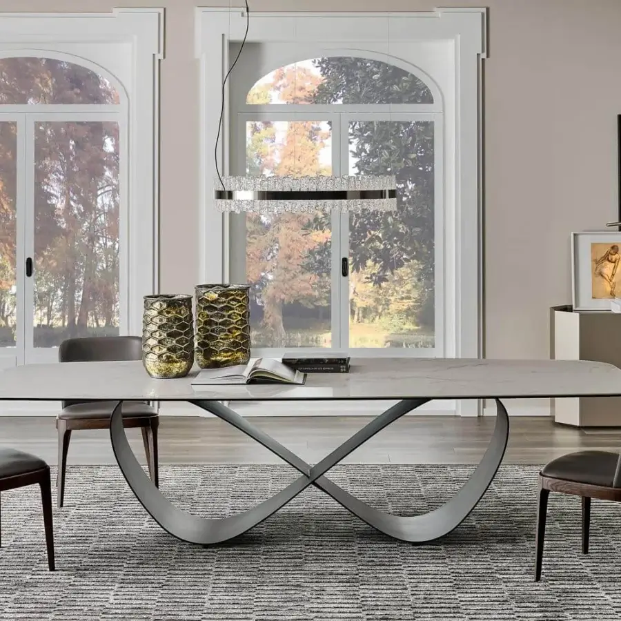 Elegant Cattelan Italia Butterfly table with brushed grey lacquered steel base and matt Makalu ceramic top