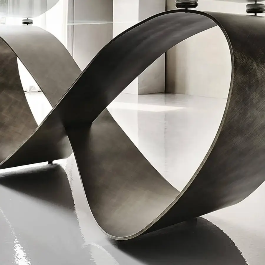 Distinguished Cattelan Italia Butterfly table with infinity base in brushed grey lacquered steel and transparent glass top crafted with tonal variations
