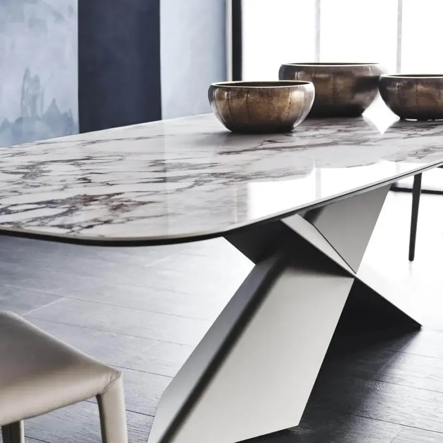 Elegant Cattelan Italia Tyron table with glossy Golden Calacatta marmi ceramic and satin graphite embossed lacquered steel base