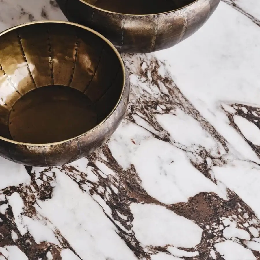 Lavish Cattelan Italia Tyron table with marmi ceramic showcasing white, brown and dark lines in a Golden Calacatta finish