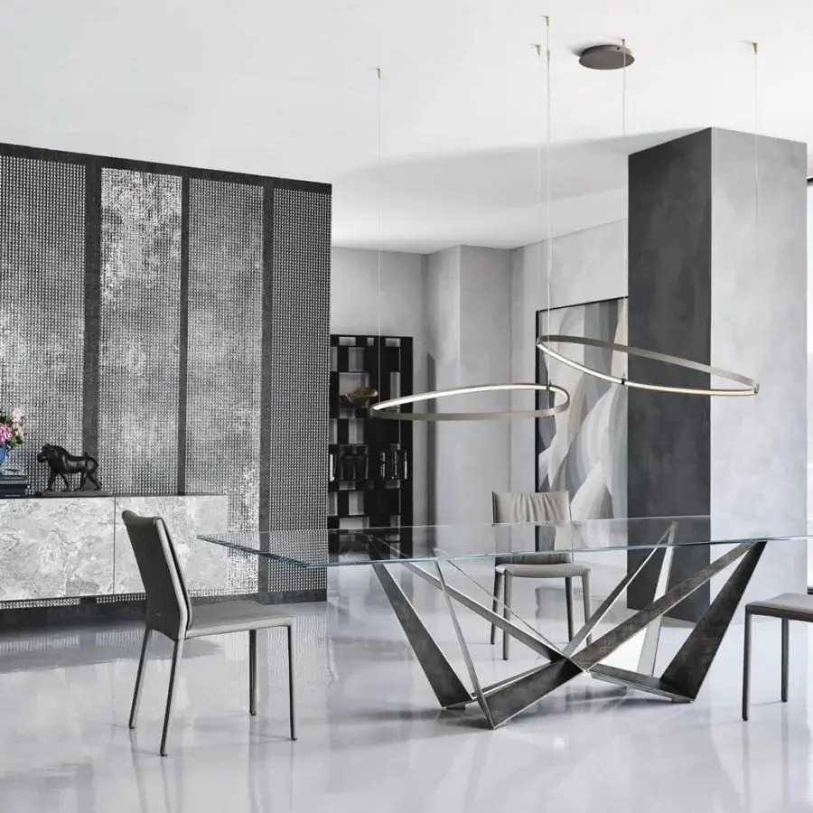Innovative Cattelan Italia Magellano suspension lamp with an asymmetrical round diffuser in titanium embossed lacquered steel